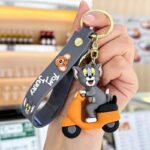 Unyks Star Cartoon Keychains for Girls & Boys – Cute Silicone Keyring Accessories for Kids, Fun Charms for Backpack, Purse, Car – Kawaii Key Holder Gift for Birthday (Tom Scooty Orange)